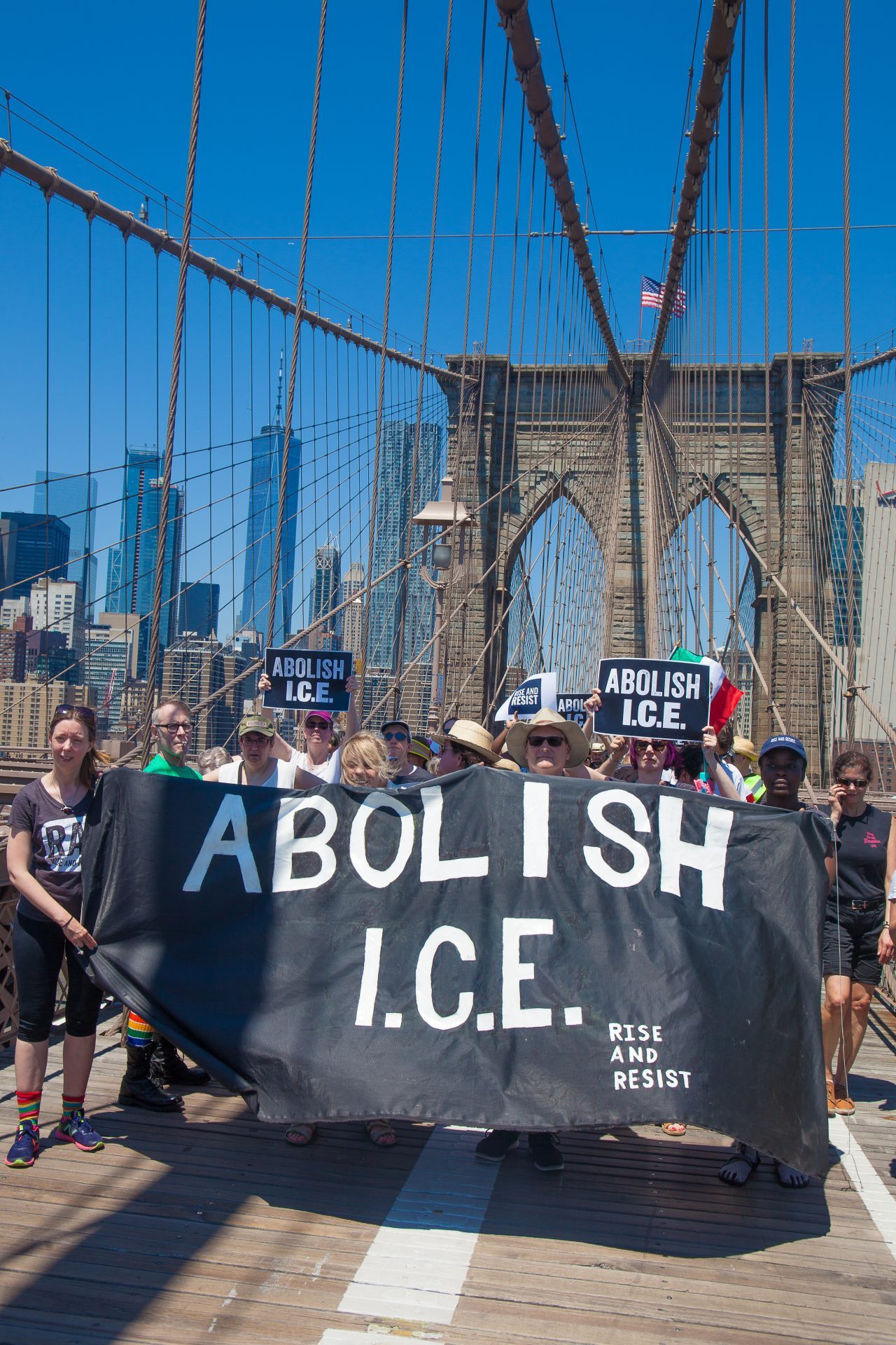 6/30/2018. New York City - March: “Families Belong Together.” People with a banner that reads: "ABOLISH I.C.E. Rise and resist." People crossing the Brooklyn Bridge in support of refugee families. People’s protectors are marching from Foley Square in Manhattan to Cadman Plaza in Brooklyn. Credit: Photo by Javier Soriano/LoveIsAmor.com