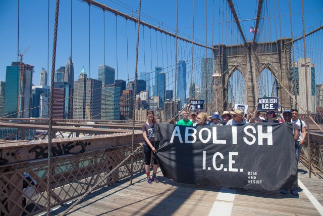 6/30/2018. New York City - March: “Families Belong Together.” People with a banner that reads: "ABOLISH I.C.E. Rise and resist." People crossing the Brooklyn Bridge in support of refugee families. People’s protectors are marching from Foley Square in Manhattan to Cadman Plaza in Brooklyn. Credit: Photo by Javier Soriano/LoveIsAmor.com