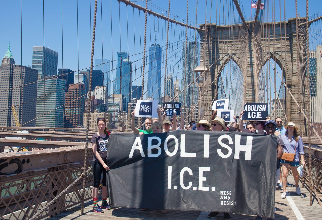 6/30/2018. New York City - March: “Families Belong Together.” People with a banner that reads: "ABOLISH I.C.E. Rise and resist." People crossing the Brooklyn Bridge in support of refugee families. People’s protectors are marching from Foley Square in Manhattan to Cadman Plaza in Brooklyn. Credit: Photo by Javier Soriano/LoveIsAmor.com