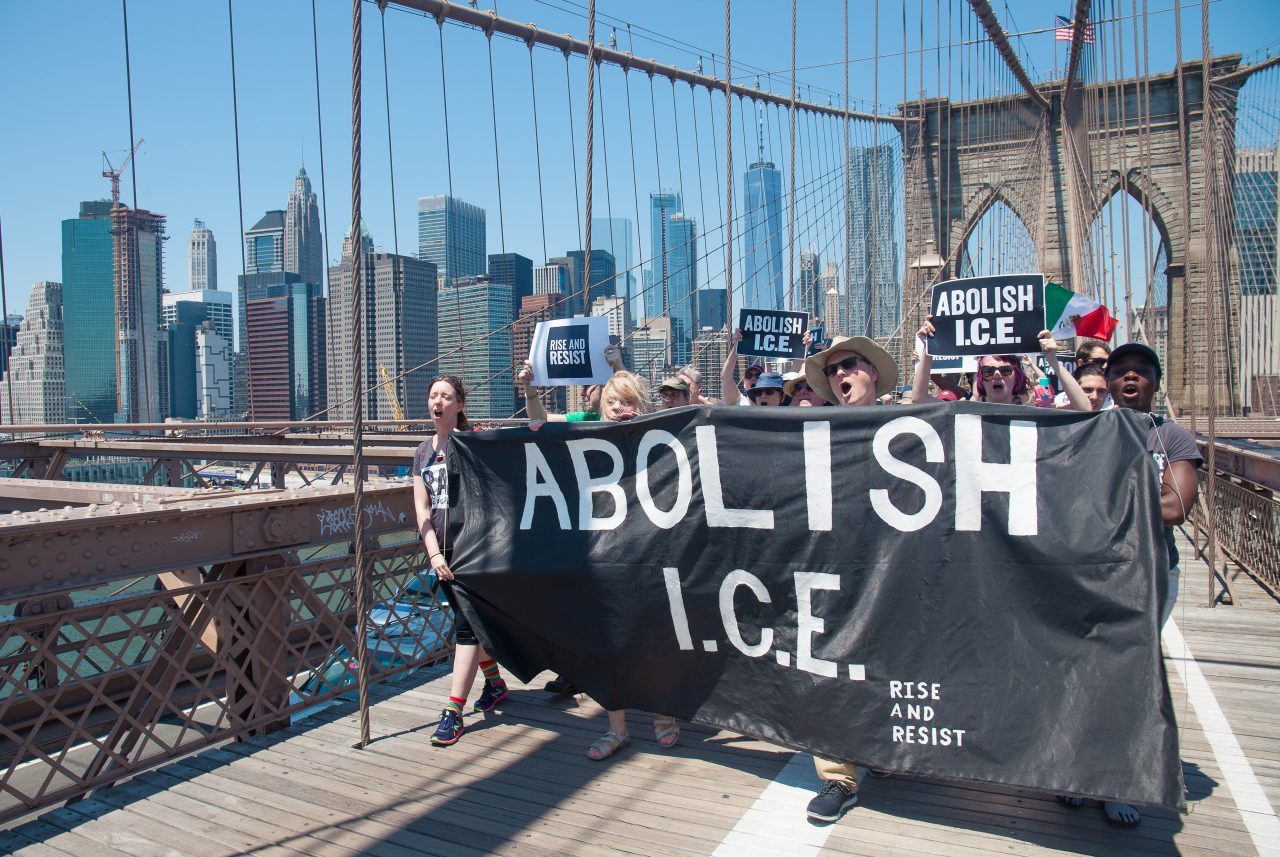 6/30/2018. New York City - March: “Families Belong Together.” People with a banner that reads: "ABOLISH I.C.E. Rise and resist." People crossing the Brooklyn Bridge in support of refugee families. People’s protectors are marching from Foley Square in Manhattan to Cadman Plaza in Brooklyn. Credit: Photo by Javier Soriano/LoveIsAmor.com