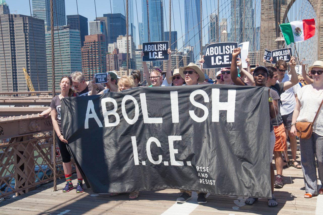 6/30/2018. New York City - March: “Families Belong Together.” People with a banner that reads: "ABOLISH I.C.E. Rise and resist." People crossing the Brooklyn Bridge in support of refugee families. People’s protectors are marching from Foley Square in Manhattan to Cadman Plaza in Brooklyn. Credit: Photo by Javier Soriano/LoveIsAmor.com