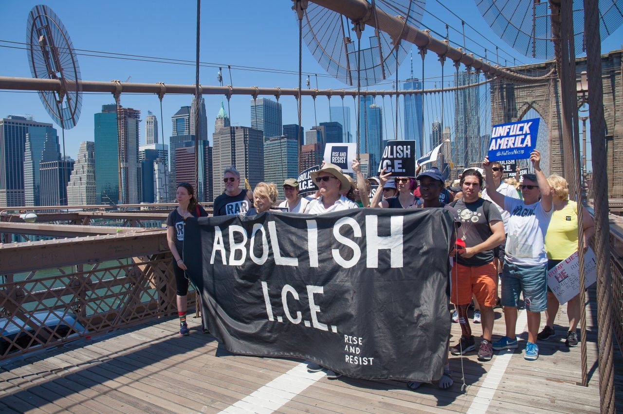 6/30/2018. New York City - March: “Families Belong Together.” People with a banner that reads: "ABOLISH I.C.E. Rise and resist." People crossing the Brooklyn Bridge in support of refugee families. People’s protectors are marching from Foley Square in Manhattan to Cadman Plaza in Brooklyn. Credit: Photo by Javier Soriano/LoveIsAmor.com