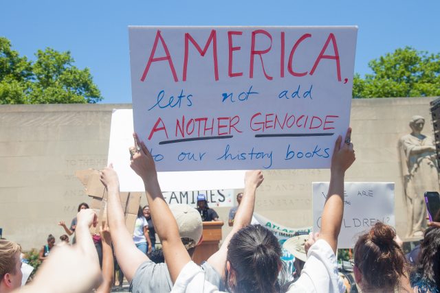6/30/2018. New York City - March: “Families Belong Together.” Woman with a sign that reads: "America, let's not add ANOTHER GENOCIDE to our history books." People at Cadman Plaza in support of refugee families. People’s protectors marched from Foley Square in Manhattan to Cadman Plaza in Brooklyn. Photo by Javier Soriano/LoveIsAmor.com