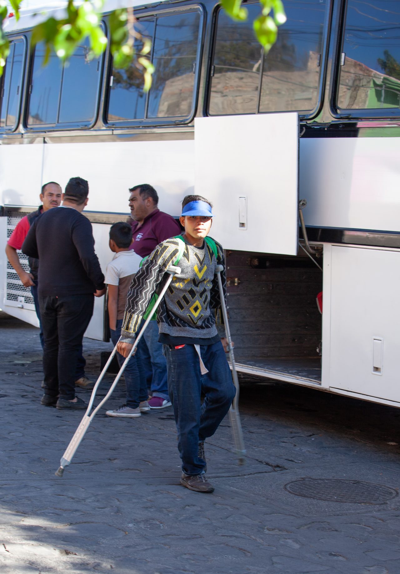 Tlaquepaque, Guadalajara. Jalisco, Mexico. Monday, November 19th, 2018. Immigrant with crutches boarding a bus to Sinaloa. Refugees fleeing violence and extreme poverty in Central America have been staying at "El Refugio. Casa del Migrante" in Tlaquepaque. Refugees want to apply for asylum in the United States of America. Credit: Photo by LoveIsAmor.com