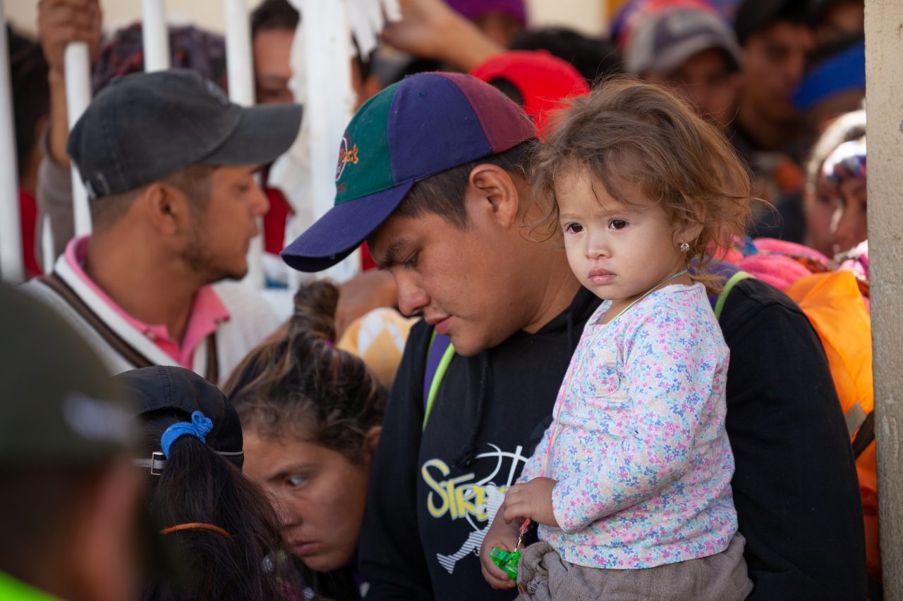 Tlaquepaque, Guadalajara. Jalisco, Mexico. Monday, November 19th, 2018. A refugee father and his child waiting his turn to board a bus to Sinaloa. Hundreds of refugees fleeing violence and extreme poverty in Central America have been staying at "El Refugio. Casa del Migrante" for one or two days. These refugees are part of the second caravan. They want to apply for asylum in the United States of America. Credit: Photo by LoveIsAmor.com