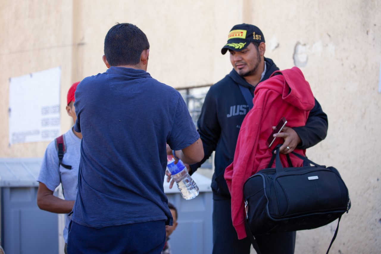 Tlaquepaque, Guadalajara. Jalisco, Mexico. Monday, November 19th, 2018. Refugee getting free water before he boards the bus that will transport him to Sinaloa. Hundreds of refugees fleeing violence and extreme poverty in Central America have been staying at "El Refugio. Casa del Migrante" for one or two days. This immigrant is part of the second caravan. Refugees want to travel to Tijuana, Baja California and apply for asylum in the United States of America. Credit: Photo by LoveIsAmor.com