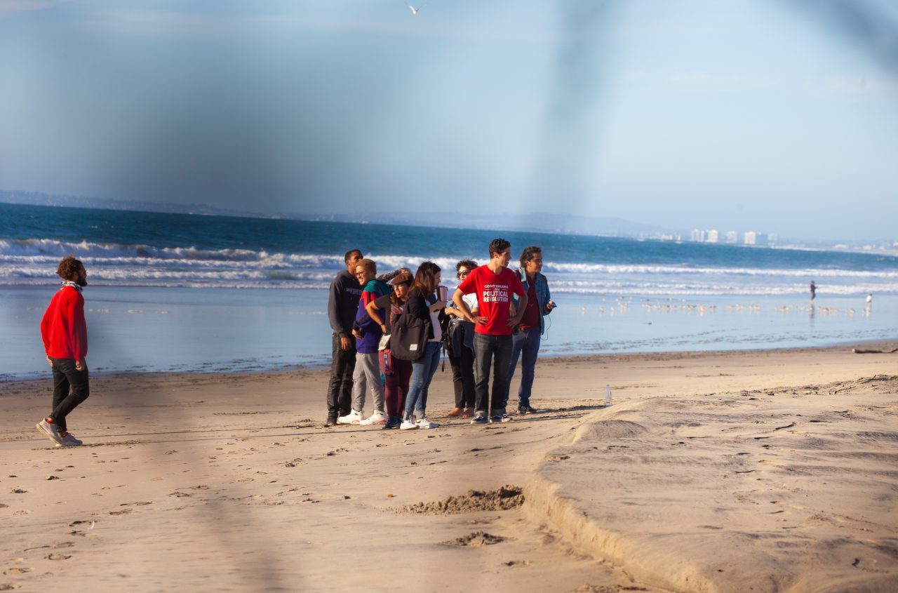 Tijuana, Baja California. Mexico. Sunday, November 25th, 2018 - Members of the Democratic Socialists Of America (DSA) gave water to immigrants from Centro America at the Mexico - US border. US border agents ordered them to move away from the fence. Credit: Photo by LoveIsAmor.com