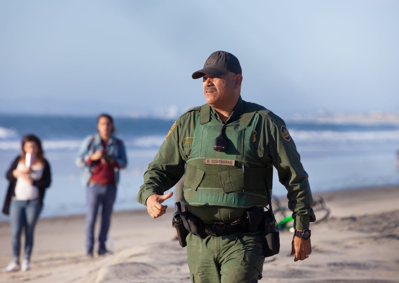 Tijuana, Baja California. Mexico. Sunday, November 25th, 2018 - Members of the Democratic Socialists Of America (DSA) gave water to immigrants from Centro America at the Mexico - US border. US border agents ordered them to move away from the fence. Credit: Photo by LoveIsAmor.com