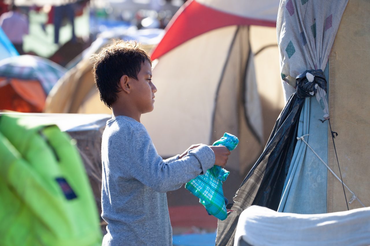 Tijuana, Baja California. Mexico. Monday, November 26th, 2018. A little boy refugee at Unidad Deportiva Benito Juárez (an improvised shelter for the caravans of immigrants). Refugees are fleeing violence and extreme poverty in their countries in Central America. They want to apply for asylum in the United States of America. Credit: Photo by LoveIsAmor.com
