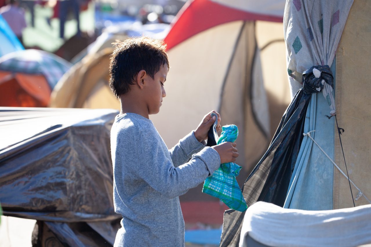 Tijuana, Baja California. Mexico. Monday, November 26th, 2018. A little boy refugee at Unidad Deportiva Benito Juárez (an improvised shelter for the caravans of immigrants). Refugees are fleeing violence and extreme poverty in their countries in Central America. They want to apply for asylum in the United States of America. Credit: Photo by LoveIsAmor.com