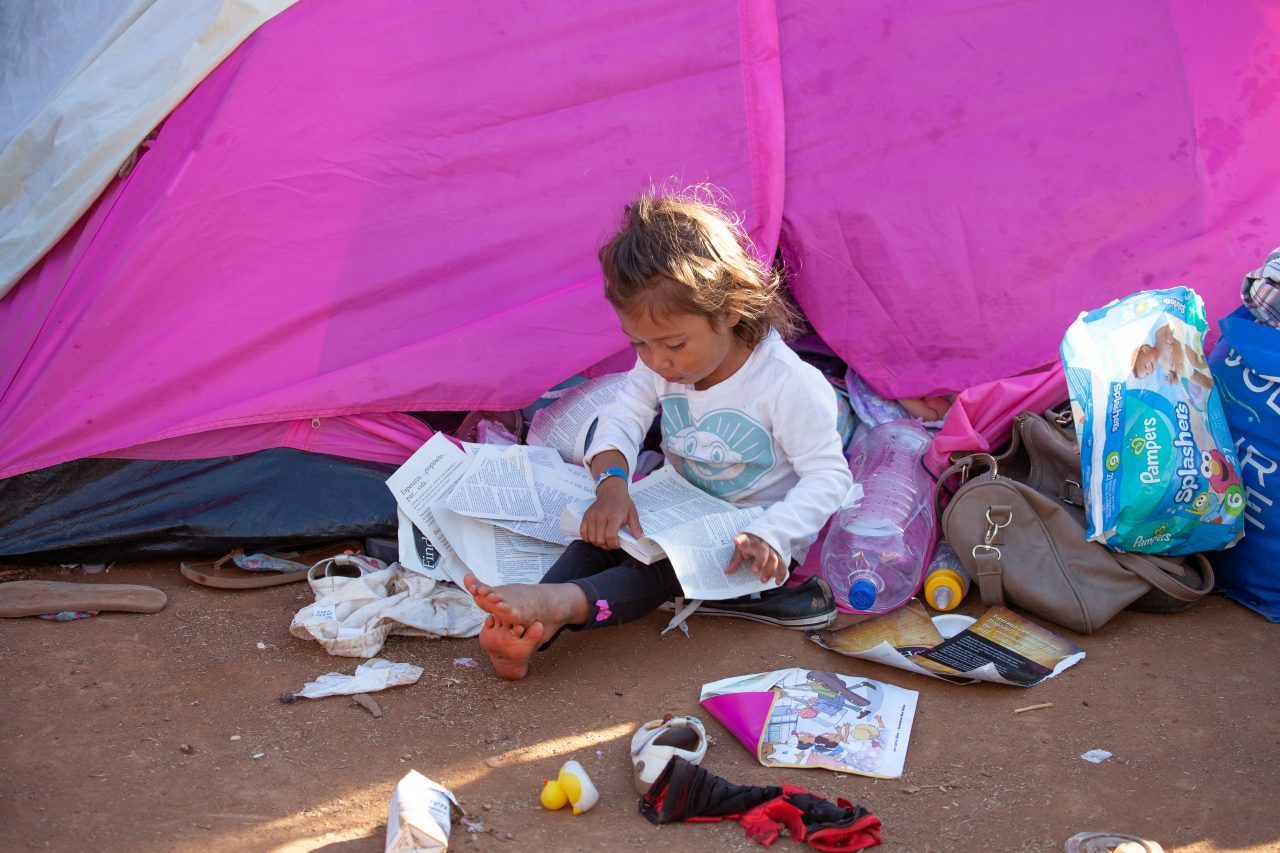 Tijuana, Baja California. Mexico. Monday, November 26th, 2018. A little girl refugee at Unidad Deportiva Benito Juárez (an improvised shelter for the caravans of immigrants). Refugees are fleeing violence and extreme poverty in their countries in Central America. They want to apply for asylum in the United States of America. Credit: Photo by LoveIsAmor.com
