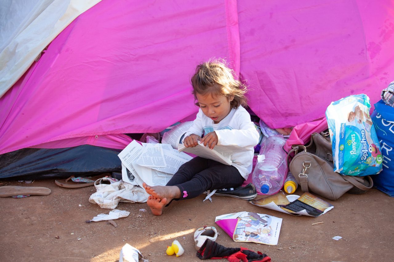 Tijuana, Baja California. Mexico. Monday, November 26th, 2018. A little girl refugee at Unidad Deportiva Benito Juárez (an improvised shelter for the caravans of immigrants). Refugees are fleeing violence and extreme poverty in their countries in Central America. They want to apply for asylum in the United States of America. Credit: Photo by LoveIsAmor.com