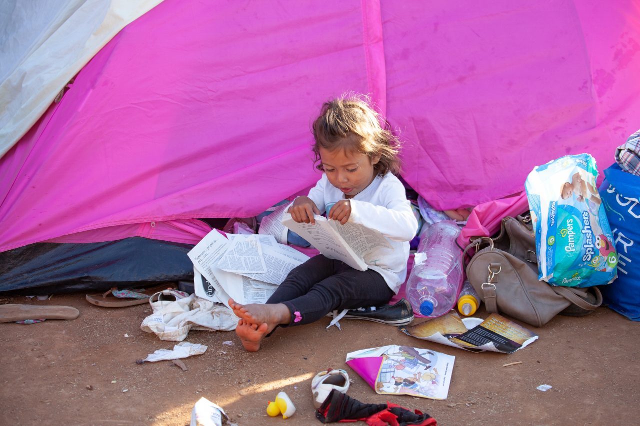 Tijuana, Baja California. Mexico. Monday, November 26th, 2018. A little girl refugee at Unidad Deportiva Benito Juárez (an improvised shelter for the caravans of immigrants). Refugees are fleeing violence and extreme poverty in their countries in Central America. They want to apply for asylum in the United States of America. Credit: Photo by LoveIsAmor.com