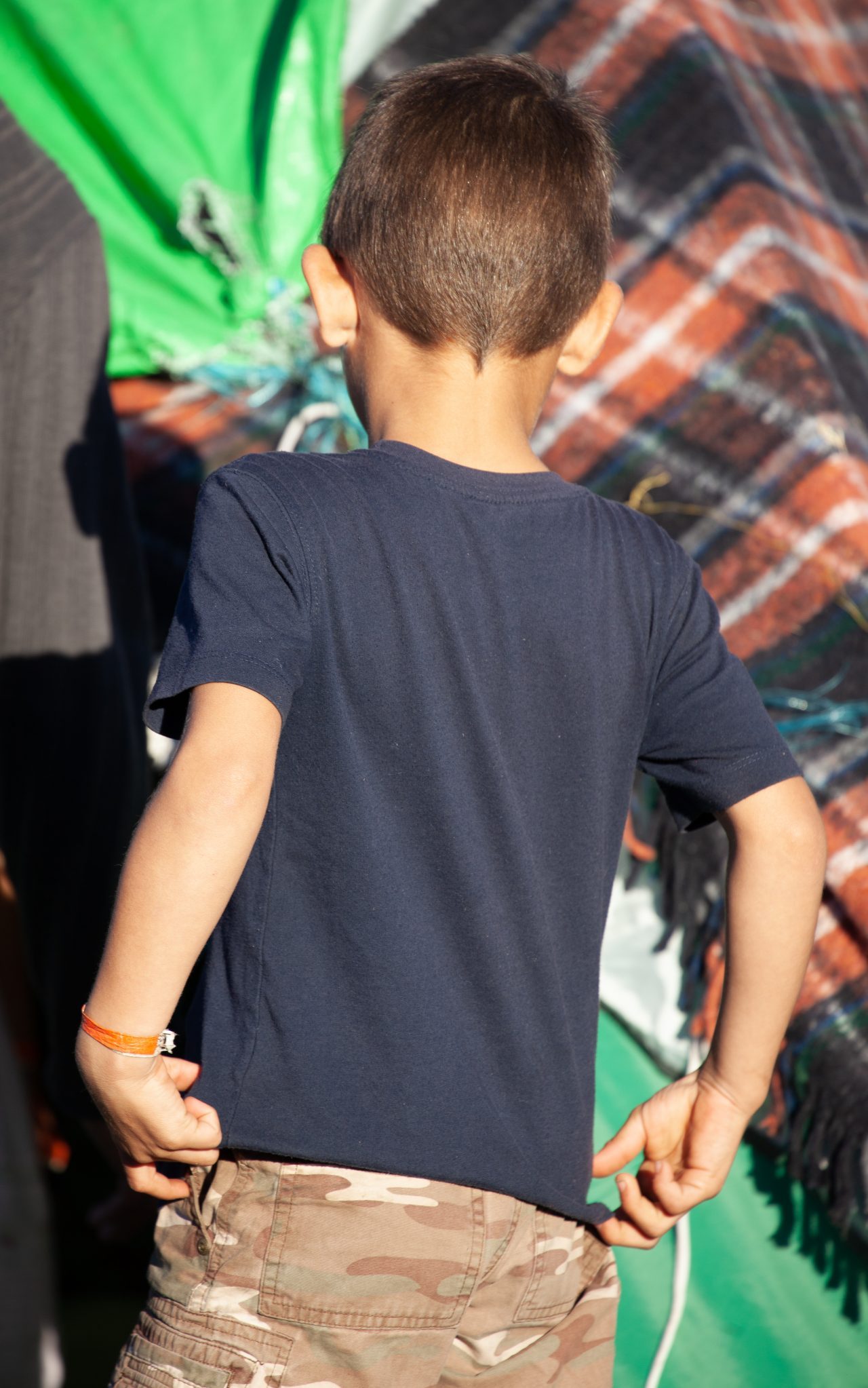 Tijuana, Baja California. Mexico. Monday, November 26th, 2018. A little boy refugee at Unidad Deportiva Benito Juárez (an improvised shelter for the caravans of immigrants). Refugees are fleeing violence and extreme poverty in their countries in Central America. They want to apply for asylum in the United States of America. Credit: Photo by LoveIsAmor.com