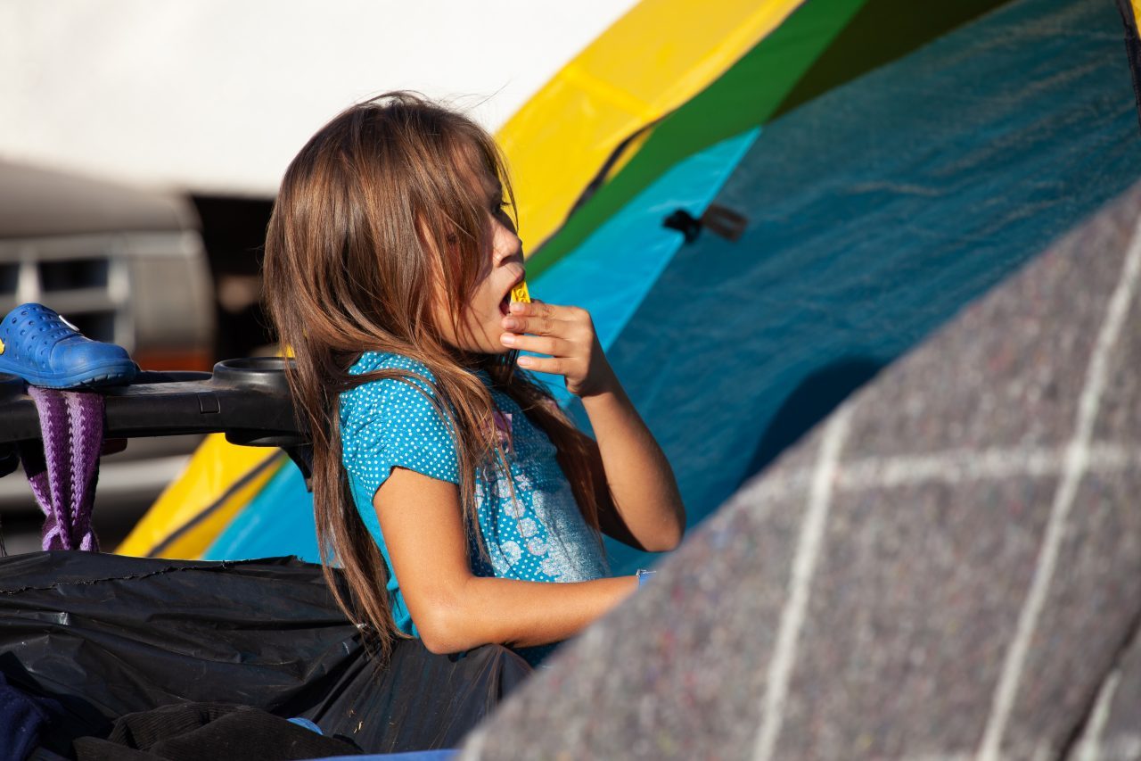Tijuana, Baja California. Mexico. Monday, November 26th, 2018. A little girl refugee at Unidad Deportiva Benito Juárez (an improvised shelter for the caravans of immigrants). Refugees are fleeing violence and extreme poverty in their countries in Central America. They want to apply for asylum in the United States of America. Credit: Photo by LoveIsAmor.com