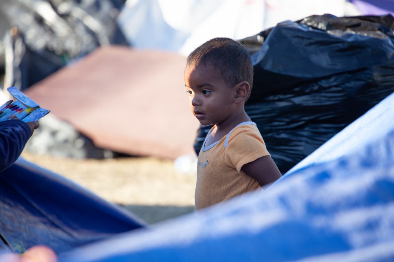 Tijuana, Baja California. Mexico. Monday, November 26th, 2018. A little boy refugee at Unidad Deportiva Benito Juárez (an improvised shelter for the caravans of immigrants). Refugees are fleeing violence and extreme poverty in their countries in Central America. They want to apply for asylum in the United States of America. Credit: Photo by LoveIsAmor.com