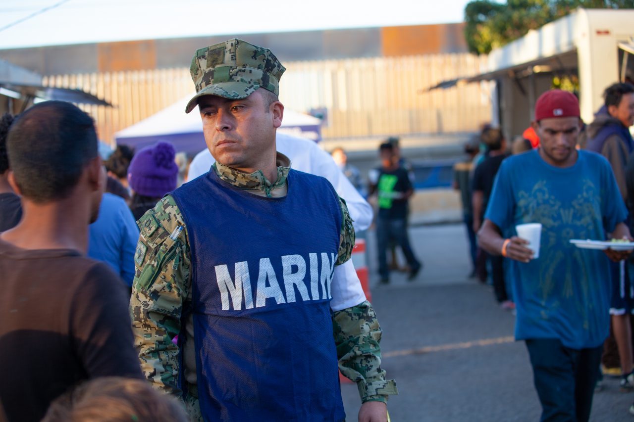 Tijuana, Baja California. Mexico. Monday, November 26th, 2018. Mexican MARINA giving food to refugees staying at Unidad Deportiva Benito Juárez (an improvised shelter for the caravans of immigrants). Refugees are fleeing violence and extreme poverty in their countries in Central America. They want to apply for asylum in the United States of America. Credit: Photo by LoveIsAmor.com