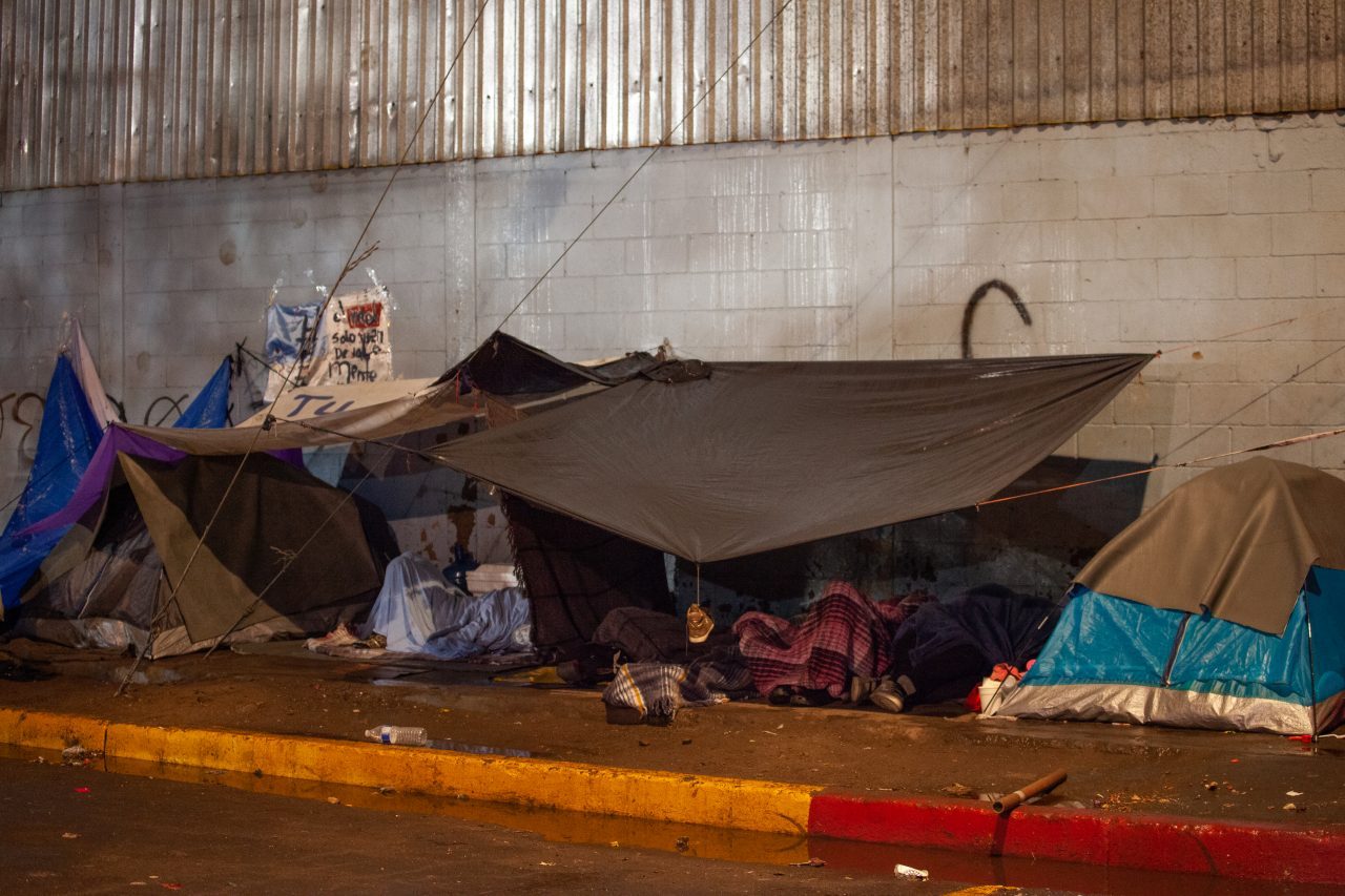 Tijuana, Baja California. Mexico. Thursday, November 29th, 2018. Refugees sleeping outside Unidad Deportiva Benito Juárez (an improvised shelter for the caravans of immigrants). It was raining last night and it was raining all day today. Refugees are fleeing violence in their countries in Central America. They want to apply for asylum in the United States of America. Credit: Photo by LoveIsAmor.com