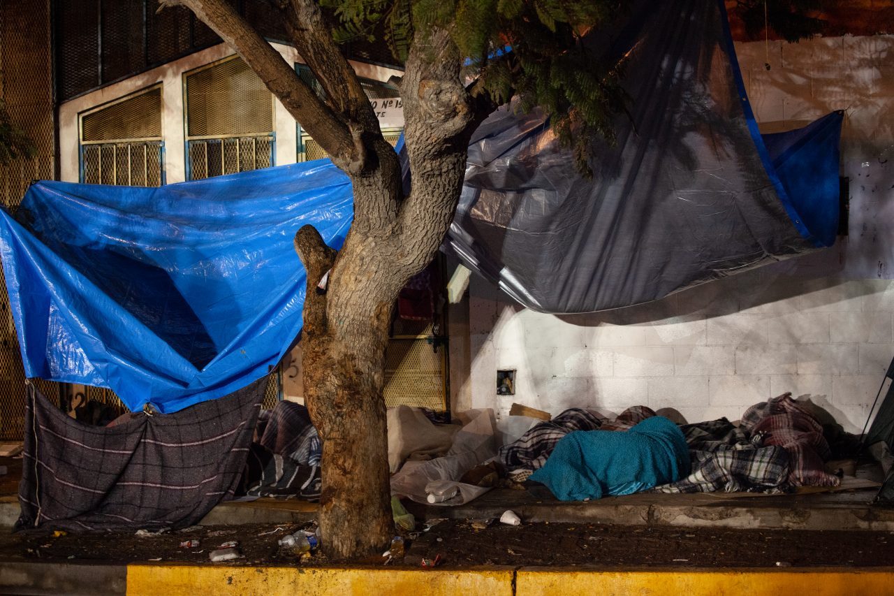 Tijuana, Baja California. Mexico. Thursday, November 29th, 2018. Refugees sleeping outside Unidad Deportiva Benito Juárez (an improvised shelter for the caravans of immigrants). It was raining last night and it was raining all day today. Refugees are fleeing violence in their countries in Central America. They want to apply for asylum in the United States of America. Credit: Photo by LoveIsAmor.com