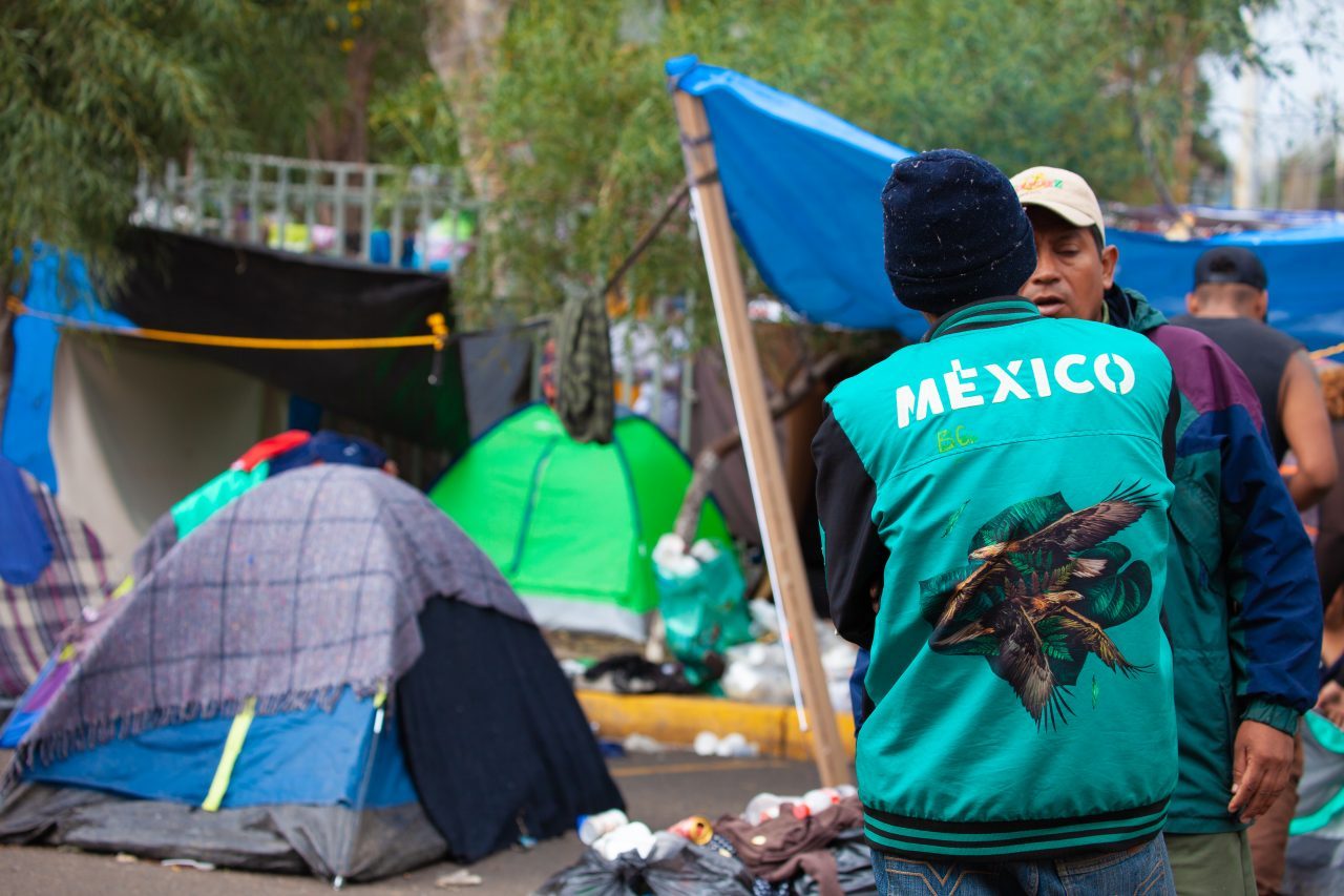 Tijuana, Baja California. Mexico. Thursday, November 29th, 2018. Refugees outside Unidad Deportiva Benito Juárez (an improvised shelter for the caravans of immigrants). It was raining last night and it was raining all day today. The Mexican government needs to find a shelter for the refugees where they can be protected from the rain and cold. Refugees are fleeing violence in their countries in Central America. They want to apply for asylum in the United States of America. They were told they have to wait more than a month to apply for asylum. Credit: Photo by LoveIsAmor.com