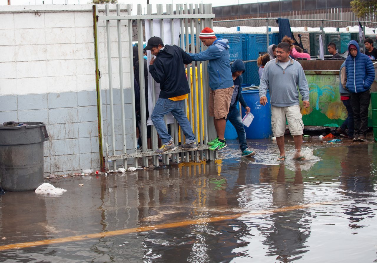 Tijuana, Baja California. Mexico. Thursday, November 29th, 2018. It was raining last night and it was raining all day today. The Mexican government needs to find a shelter for the refugees where they can be protected from the rain and cold. Refugees are staying at Unidad Deportiva Benito Juárez (an improvised shelter for the caravans of immigrants). Refugees are fleeing violence in their countries in Central America. They want to apply for asylum in the United States of America. They were told they have to wait more than a month to apply for asylum. Credit: Photo by LoveIsAmor.com