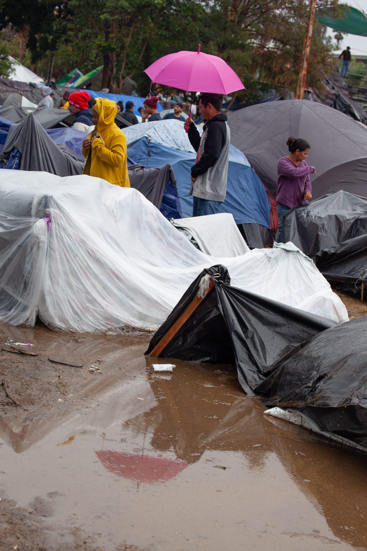 Tijuana, Baja California. Mexico. Thursday, November 29th, 2018. It was raining last night and it was raining all day today. The Mexican government needs to find a shelter for the refugees where they can be protected from the rain and cold. Refugees are staying at Unidad Deportiva Benito Juárez (an improvised shelter for the caravans of immigrants). Refugees are fleeing violence in their countries in Central America. They want to apply for asylum in the United States of America. They were told they have to wait more than a month to apply for asylum. Credit: Photo by LoveIsAmor.com