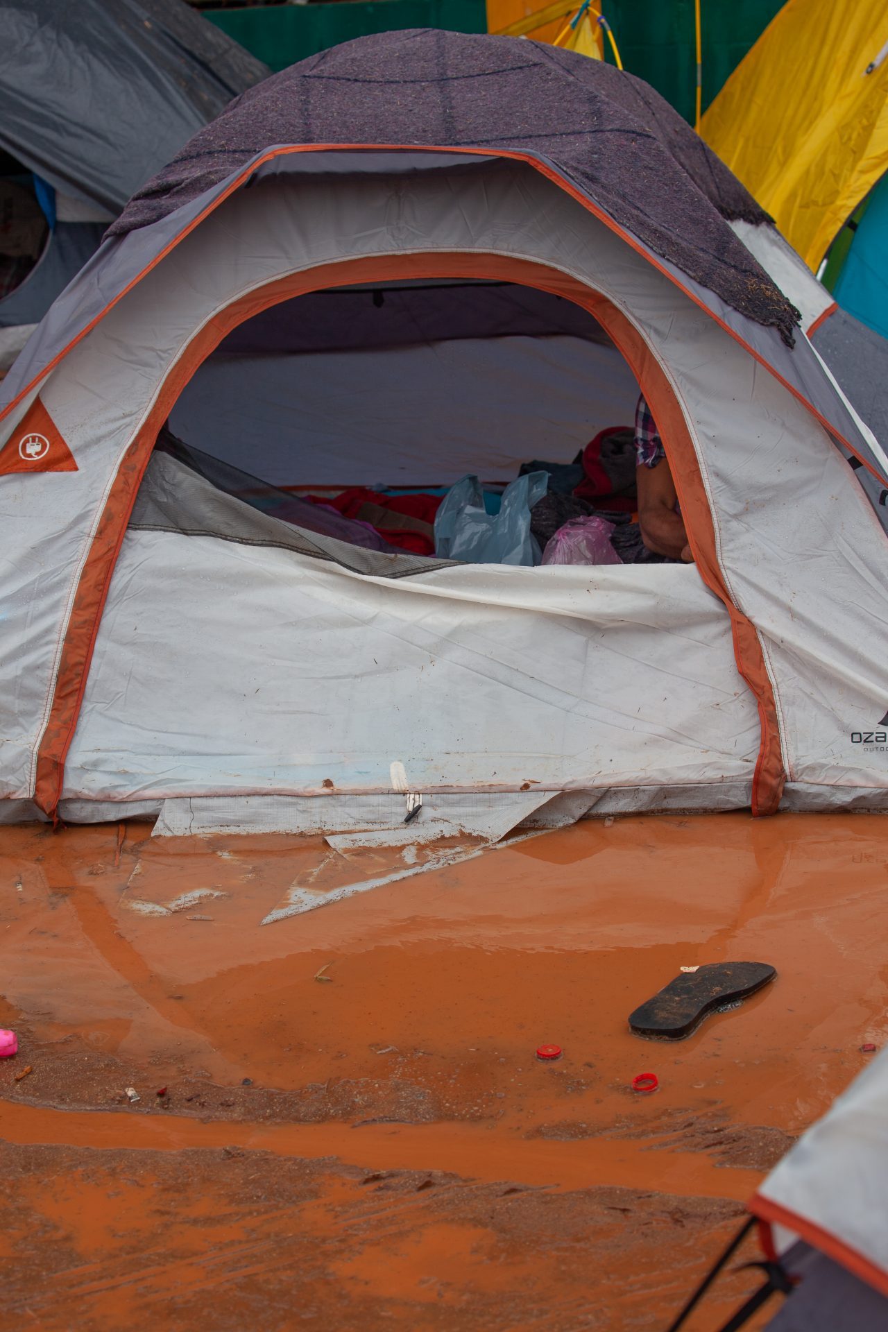 Tijuana, Baja California. Mexico. Thursday, November 29th, 2018. It was raining last night and it was raining all day today. The Mexican government needs to find a shelter for the refugees where they can be protected from the rain and cold. Refugees are staying at Unidad Deportiva Benito Juárez (an improvised shelter for the caravans of immigrants). Refugees are fleeing violence in their countries in Central America. They want to apply for asylum in the United States of America. They were told they have to wait more than a month to apply for asylum. Credit: Photo by LoveIsAmor.com