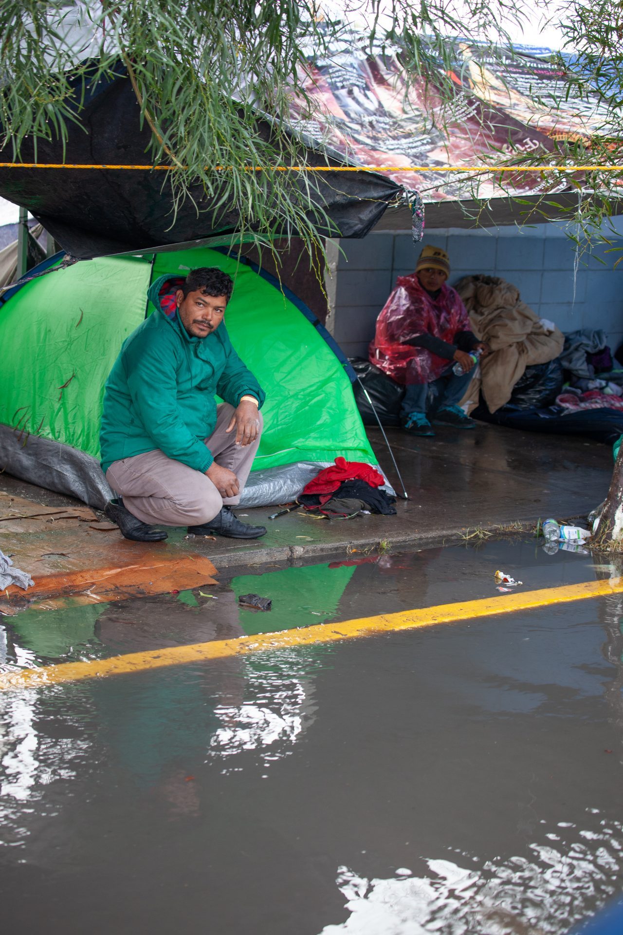 Tijuana, Baja California. Mexico. Thursday, November 29th, 2018. It was raining last night and it was raining all day today. The Mexican government needs to find a shelter for the refugees where they can be protected from the rain and cold. Refugees are staying at Unidad Deportiva Benito Juárez (an improvised shelter for the caravans of immigrants). Refugees are fleeing violence in their countries in Central America. They want to apply for asylum in the United States of America. They were told they have to wait more than a month to apply for asylum. Credit: Photo by LoveIsAmor.com