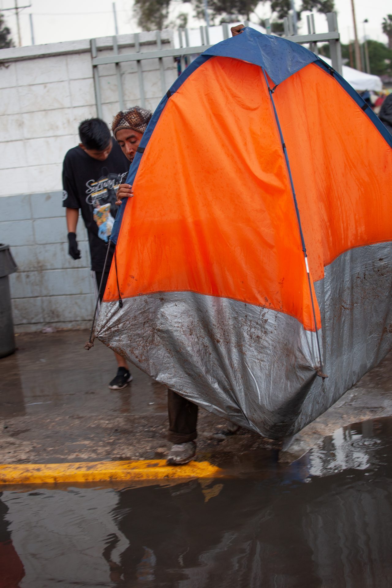 Tijuana, Baja California. Mexico. Thursday, November 29th, 2018. It was raining last night and it was raining all day today. The Mexican government needs to find a shelter for the refugees where they can be protected from the rain and cold. Refugees are staying at Unidad Deportiva Benito Juárez (an improvised shelter for the caravans of immigrants). Refugees are fleeing violence in their countries in Central America. They want to apply for asylum in the United States of America. They were told they have to wait more than a month to apply for asylum. Credit: Photo by LoveIsAmor.com