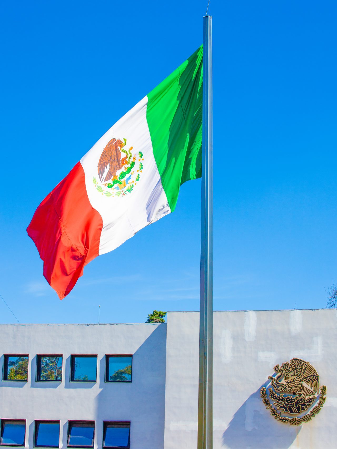 Mexico City, Mexico. Saturday, December 1, 2018. Mexican flag at Los Pinos. The "Official Residence of Los Pinos" was the residence of the Mexican presidents. As of Saturday, December 1, 2018, it will be known as the "Los Pinos Cultural Complex." The official website says: "Los Pinos will be a completely open space for all Mexicans." Today was the inauguration of Mexican President Andrés Manuel López Obrador. People came to Los Pinos to celebrate this historic day. Credit: Photo by LoveIsAmor.com