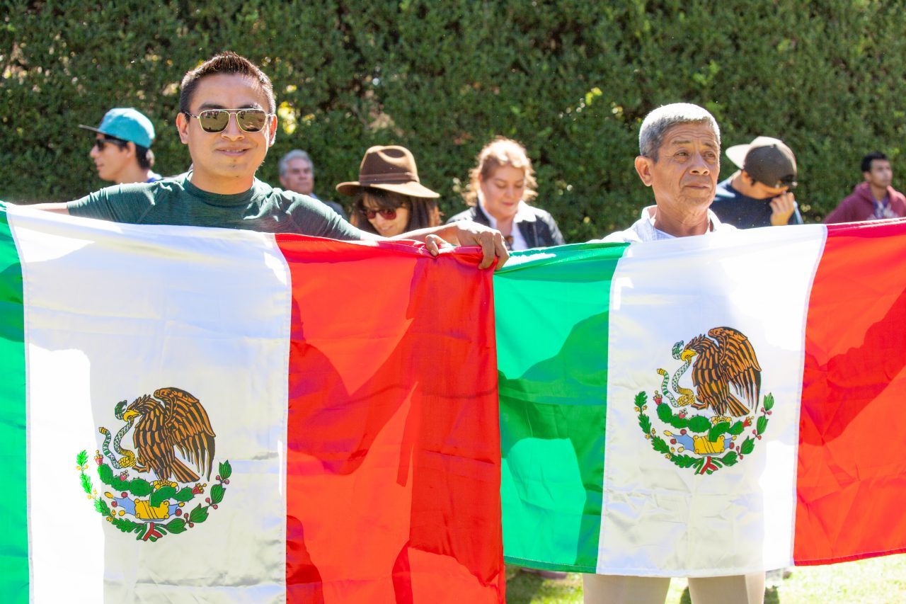 Mexico City, Mexico. Saturday, December 1, 2018. Men with the Mexican flag at the new cultural facility. The "Official Residence of Los Pinos" was the residence of the Mexican presidents. As of Saturday, December 1, 2018, it will be known as the "Los Pinos Cultural Complex." The official website says: "Los Pinos will be a completely open space for all Mexicans." Today was the inauguration of Mexican President Andrés Manuel López Obrador. People came to Los Pinos to celebrate this historic day. Credit: Photo by LoveIsAmor.com