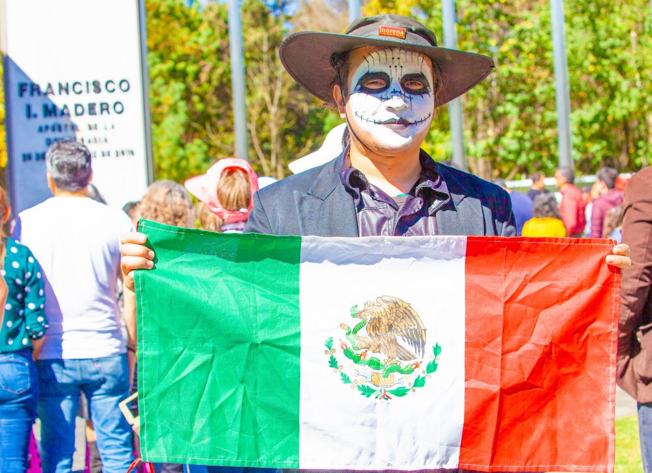 Mexico City, Mexico. Saturday, December 1, 2018. Man with the Mexican flag at the new cultural facility. The "Official Residence of Los Pinos" was the residence of the Mexican presidents. As of Saturday, December 1, 2018, it will be known as the "Los Pinos Cultural Complex." The official website says: "Los Pinos will be a completely open space for all Mexicans." Today was the inauguration of Mexican President Andrés Manuel López Obrador. People came to Los Pinos to celebrate this historic day. Credit: Photo by LoveIsAmor.com