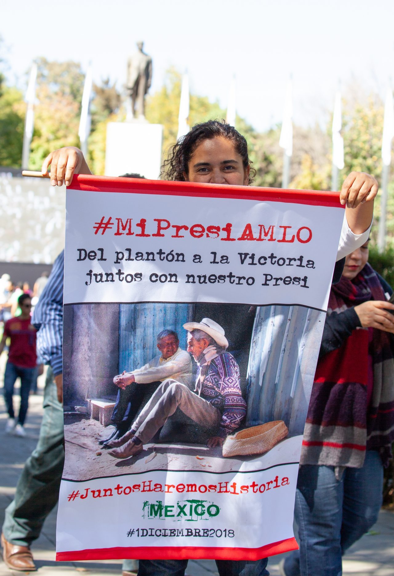 Mexico City, Mexico. Saturday, December 1, 2018. Woman at the new cultural facility. Her sign says: "#MiPresiAMLO. Del plantón a la victoria. Juntos con nuestro Presi. #JuntosHaremosHistoria. Mexico." The "Official Residence of Los Pinos" was the residence of the Mexican presidents. As of Saturday, December 1, 2018, it will be known as the "Los Pinos Cultural Complex." The official website says: "Los Pinos will be a completely open space for all Mexicans." Today was the inauguration of Mexican President Andrés Manuel López Obrador. People came to Los Pinos to celebrate this historic day. Credit: Photo by LoveIsAmor.com