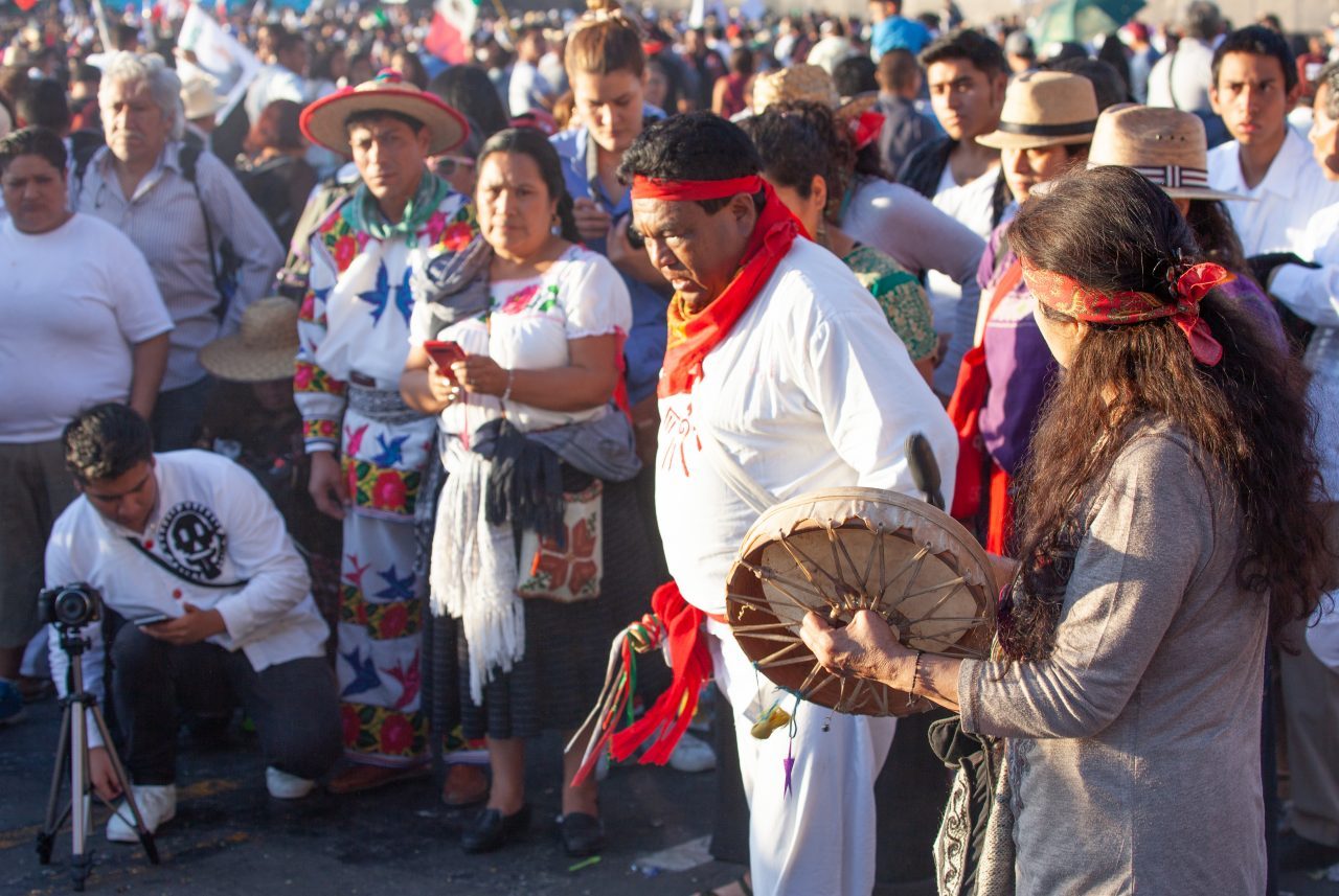 Mexico City, Mexico. Saturday, December 1, 2018. Mexicans celebrate on the Zocalo the inauguration of Mexican President Andrés Manuel López Obrador. People came to celebrate this historic day. López Obrador – known as AMLO - said, “We are going to govern for everyone, but we are going to give preference to the most impoverished and vulnerable. For the good of all, the poor come first.” Andrés Manuel received a spiritual cleansing by indigenous women and men as part of the celebrations. “What we want, what we desire is to purify public life in Mexico. I repeat my commitment: I will not lie, I will not steal or betray the people of Mexico,” the new President said during the religious ceremony. Credit: Photo by LoveIsAmor.com
