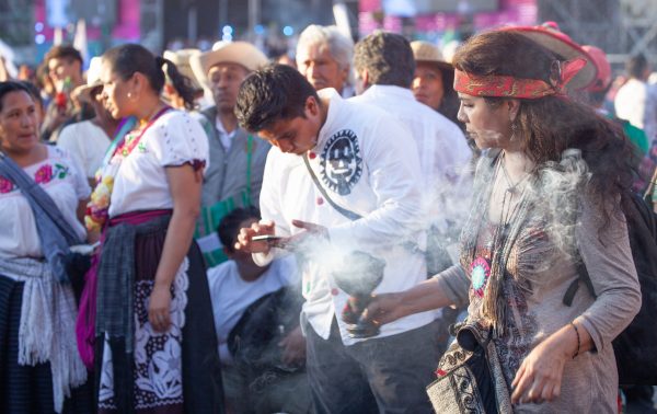 Mexico City, Mexico. Saturday, December 1, 2018. Mexicans celebrate on the Zocalo the inauguration of Mexican President Andrés Manuel López Obrador. People came to celebrate this historic day. López Obrador – known as AMLO - said, “We are going to govern for everyone, but we are going to give preference to the most impoverished and vulnerable. For the good of all, the poor come first.” Andrés Manuel received a spiritual cleansing by indigenous women and men as part of the celebrations. “What we want, what we desire is to purify public life in Mexico. I repeat my commitment: I will not lie, I will not steal or betray the people of Mexico,” the new President said during the religious ceremony. Credit: Photo by LoveIsAmor.com
