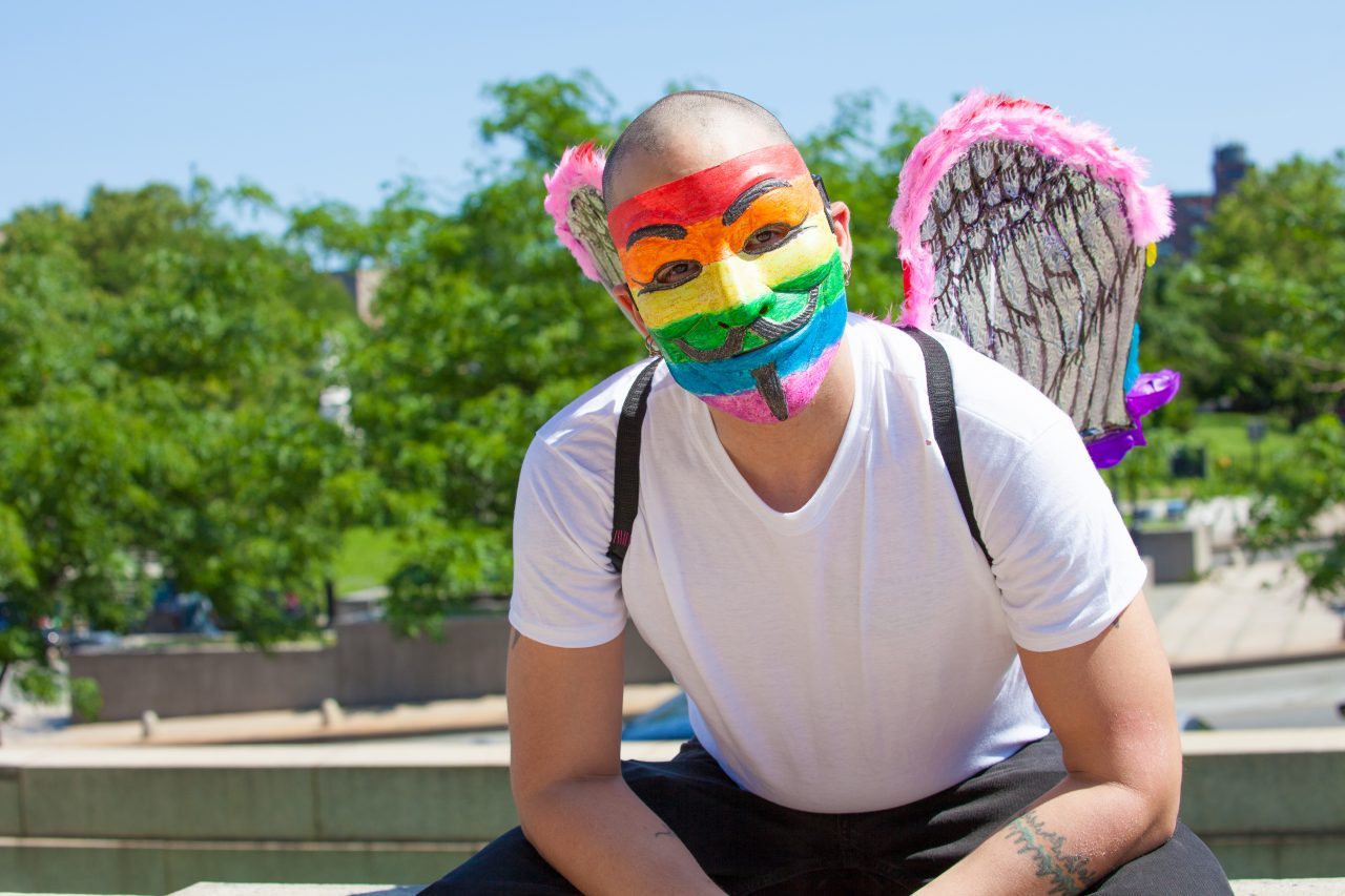Sunday, June 23rd, 2019. Bronx, New York City - Today was the 1 Bronx World Pride Rally, March and Festival. Today people celebrated Bronx World Pride, Pride Month and the 50th anniversary of the Stonewall Rebellion. This Latino man was one of the attendees who came to celebrate Bronx World Pride, Pride Month and the 50th anniversary of the Stonewall rebellion. He was wearing a rainbow mask and a rainbow wings. Credit: Photo by LoveIsAmor.com