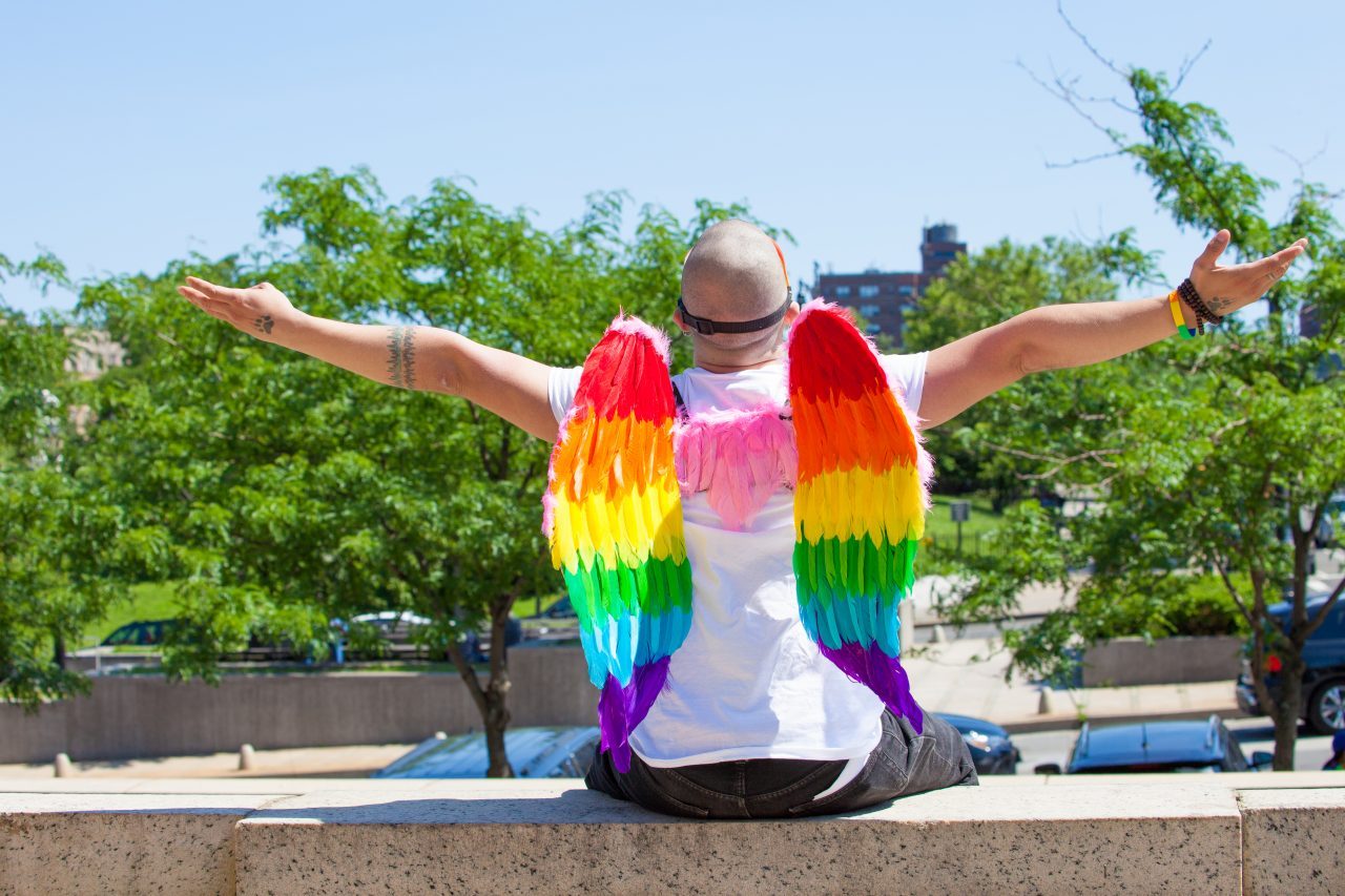 Sunday, June 23rd, 2019. Bronx, New York City - Today was the 1 Bronx World Pride Rally, March and Festival. Today people celebrated Bronx World Pride, Pride Month and the 50th anniversary of the Stonewall Rebellion. This Latino man was one of the attendees who came to celebrate Bronx World Pride, Pride Month and the 50th anniversary of the Stonewall rebellion. He was wearing a rainbow mask and a rainbow wings. Credit: Photo by LoveIsAmor.com